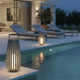 durable affordable LED outdoor lights illuminating a stylish poolside area with lounging chairs at dusk