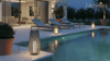 durable affordable LED outdoor lights illuminating a stylish poolside area with lounging chairs at dusk