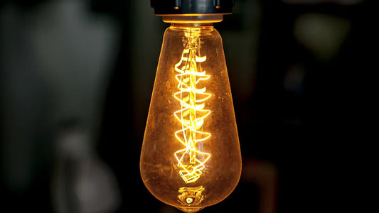 A vintage light bulb showcasing LED lighting savings in comparison to traditional bulbs.