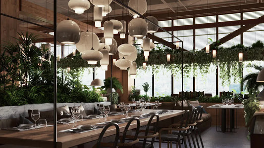 Modern restaurant interior showcasing commercial lighting trends for restaurants and vibrant greenery.