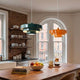 modern kitchen with colorful pendant lights and a wooden island to help you choose perfect kitchen island