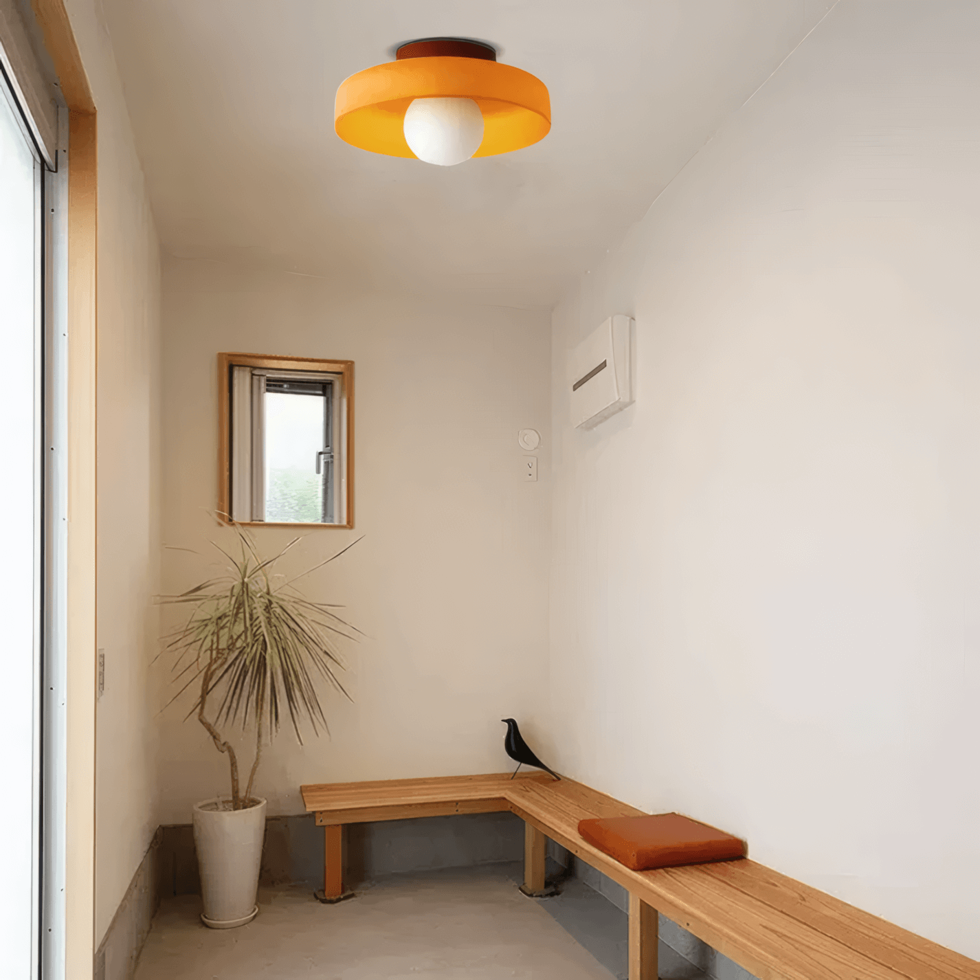 modern round ceiling light in simple room, orange metal glass
